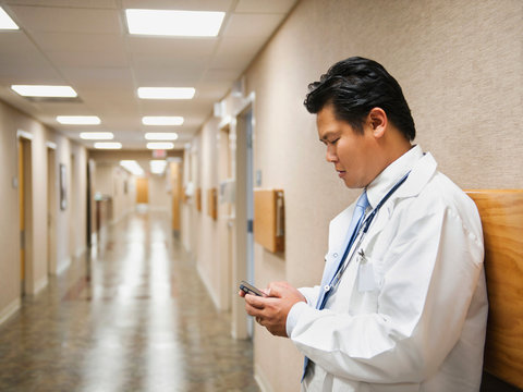 Portrait of doctor with mobile phone