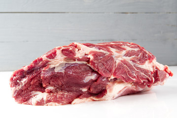Fresh raw pork neck meat isolated on white background. Pork belly on a white background. Raw pork neck boneless, close-up, isolated.