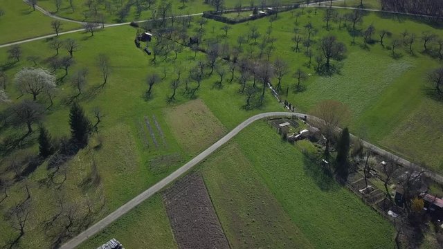 Drone flight over beautiful landscape at Beuren and Teck, Swabian Alb, Germany with people enjoying early spring