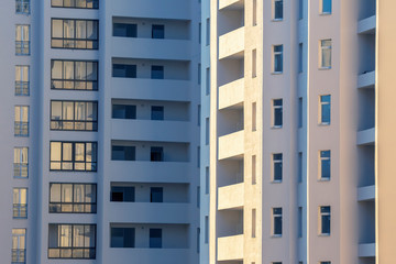 Fototapeta premium Facade of a new multi-story residential building. architecture and modern construction