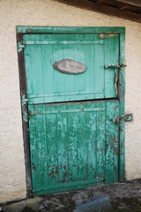 Green rusty horse stables doors