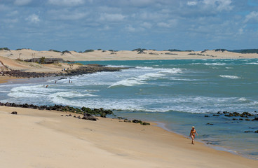 Chalk beach, Tibau do Sul, near Natal, Rio Grande do Norte, Brazil on October 15, 2013. Woman walking on the beach
