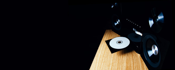 Modern CD player on a dark background. Space for text or design