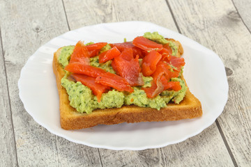 Toast with guacamole and salmon