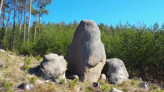 Ancient stone monument. Celtic Menhir in Sedmihori hills. Mysterious landmark in Western Bohemia. Czech Republic, Central Europe.