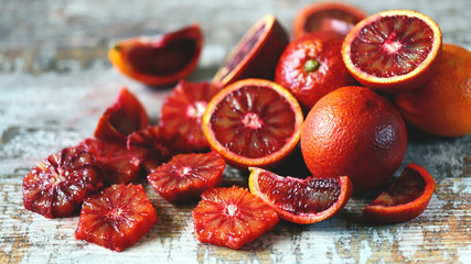 Selective focus. Macro. Red orange. Fresh juicy bloody oranges on a wooden surface.