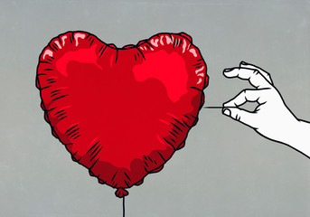 Hand with pin ready to pop red heart shape balloon