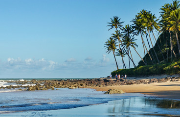 Praia do giz, Tibau do Sul, near Natal, Rio Grande do Norte, Brazil on October 15, 2013. Tourists walking on the beach