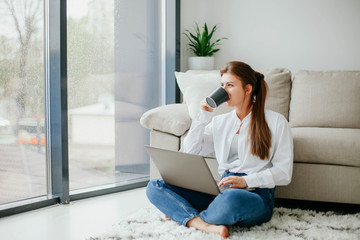 young woman working on laptop at home. work at home.  laptop. stay at home. 