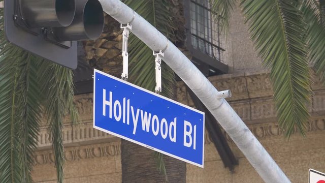 Hollywood boulevard street sign and traffic lights in 4k slow motion 60fps