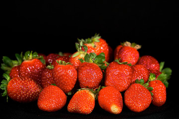 strawberries on black background