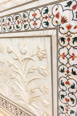 Facade details in the white marble of the Taj Mahal mausoleum in Agra, Uttar Pradesh, India