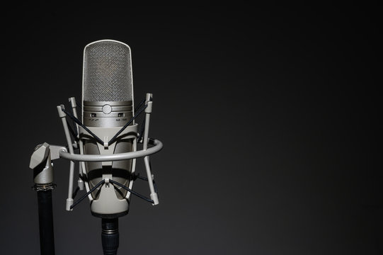 Professional, studio microphone on a black background. Is isolated..Can be used for audio, karaoke and music content.