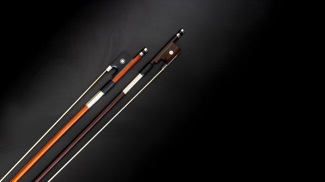 orange and brown violin bows
