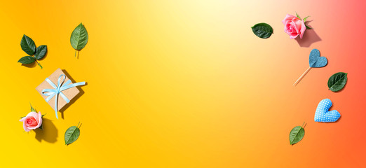 Gift box with pink roses overhead view - flat lay