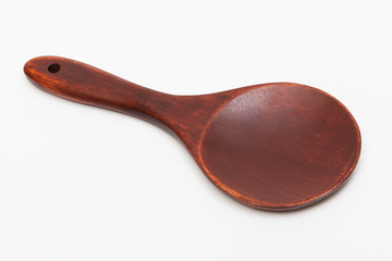 big wooden spoon on white background