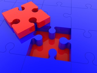 A piece of red puzzle above a blue puzzle