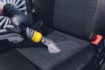 Car interior textile seats chemical cleaning with professionally extraction method. Early spring...