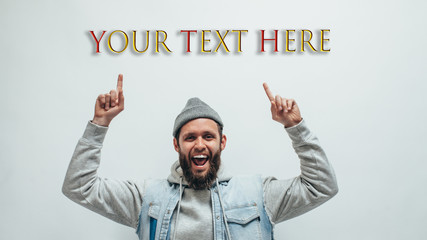 Crazy hipster guy pointing with fingers at your text or product. Crazy hipster guy emotions. Discount, sale, season sales.