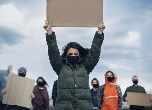 Diverse Group Of People Protesting With Blank Sign. Protest Against Human Rights, Abuse Of Freedom Or Racist Beliefs