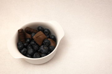 chocolate with blueberries on a white background, Wallpaper