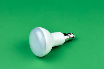 Led lamp on green background