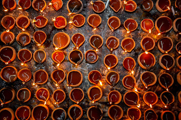Numerous Clay oil lamps are burning. Traditional festival of oil lamp symbolizing spreading of light and end of darkness.