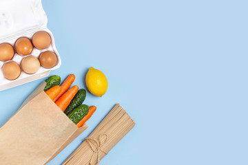 Food stock vegetables, eggs and pasta. Food delivery and donation service. Copy space.