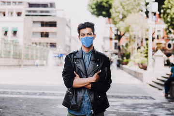 hispanic man wearing mask face to prevent infection or respiratory illness, Mexican man with Protection against contagious coronavirus in Mexico Latin America