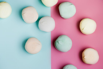 Fototapeta premium Homemade sweet colored meringue on white background. Dessert.