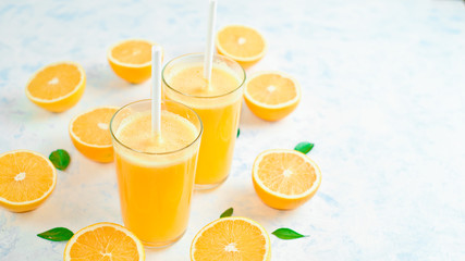 freshly squeezed orange juice and slices of orange fruit