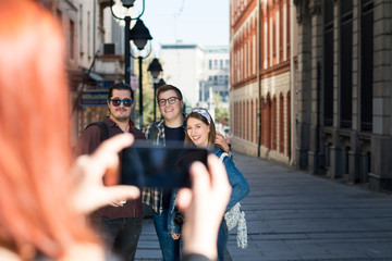 Fototapeta premium Group of millennial's sightseeing the city