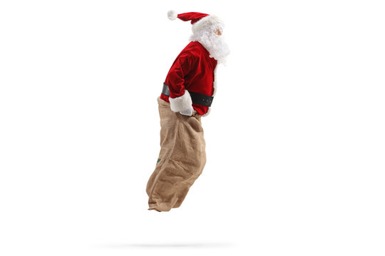 Profile shot of Santa Claus jumping inside a sack