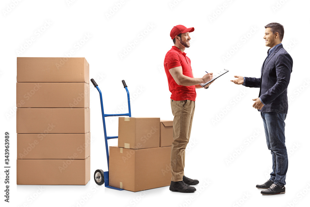 Sticker delivery man with a document handing boxes to a man