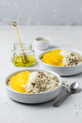 Healthy vegan breakfast, citrus seeds oatmeal. Selective focus, copy space.