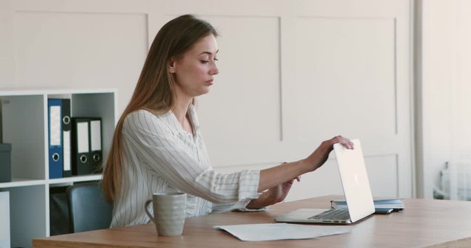 Business woman boring at workplace after finishing work