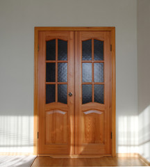 sunlight illuminates the interior doors of the apartment. the door is locked,