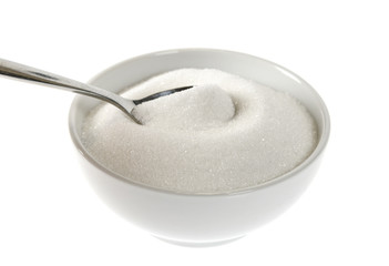 Ceramic bowl with sugar and teaspoon isolated on white background