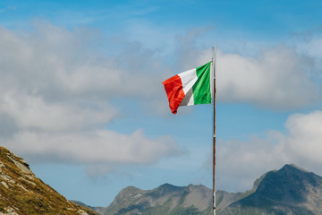 flag of italy waving in the mountains
