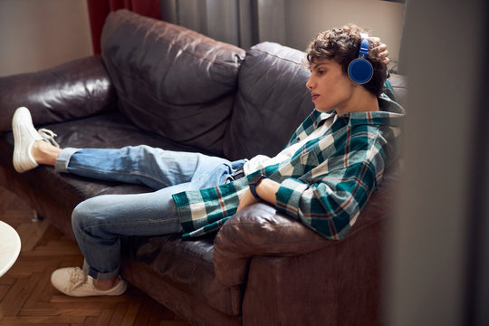 Attractive Guy Listening To Music At Home