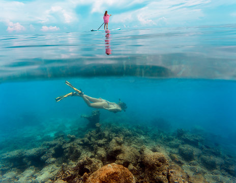 Young Women Have A Fun In Ocean Water, Underwater View