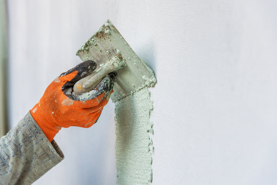 Application Of Facade Plaster in autumn.