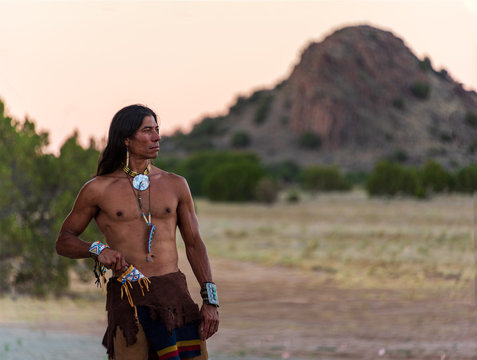 Native American man in traditional clothing 