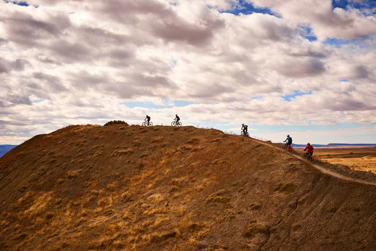 Mountain bikers riding on mountain ridge