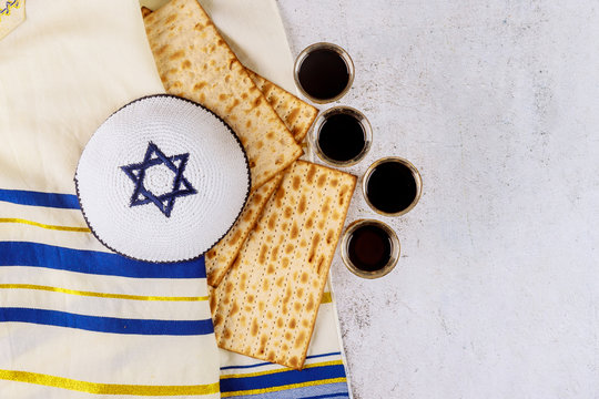 Matzoh jewish holiday red kosher four wine glasses of matza Passover Haggadah