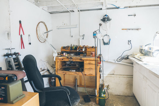 Full show of bright home studio with workbench assorted tools and more