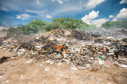 Garbage pile burning at garbage dump, Guatemala.