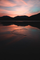 Sunrise over a beach at low tide 