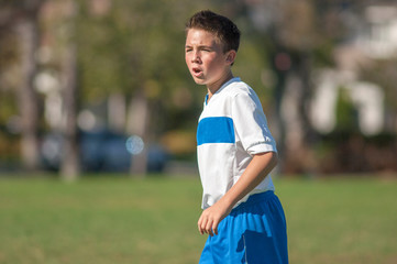 Teen soccer player yelling on the field