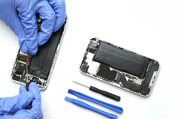Technician repairing the Cell phone parts and tools for recovery repair smartphone and upgrade...